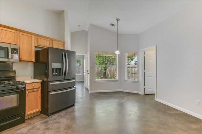 Dining area off of the kitchen with room to move. Laundry room is in the door off to the right not in a garage! | Image 6