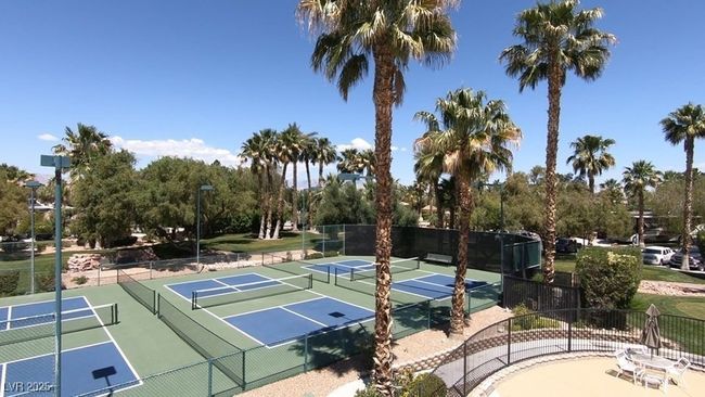 View of tennis court featuring fence | Image 10