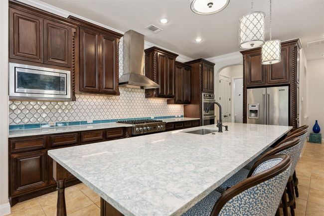 Upgraded appliance, updated Cambria Quartz Countertops throughout the home. | Image 8