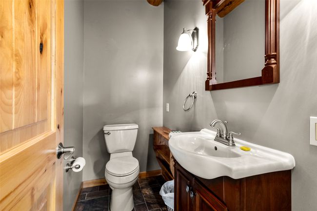 Bathroom with toilet and vanity | Image 12