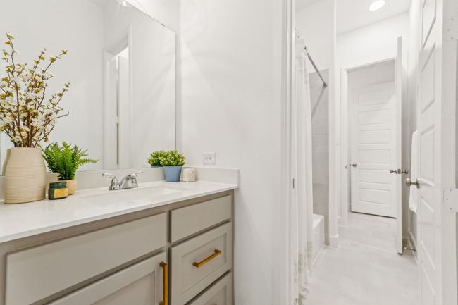 Full bathroom with vanity and shower / bath combination with curtain | Image 28