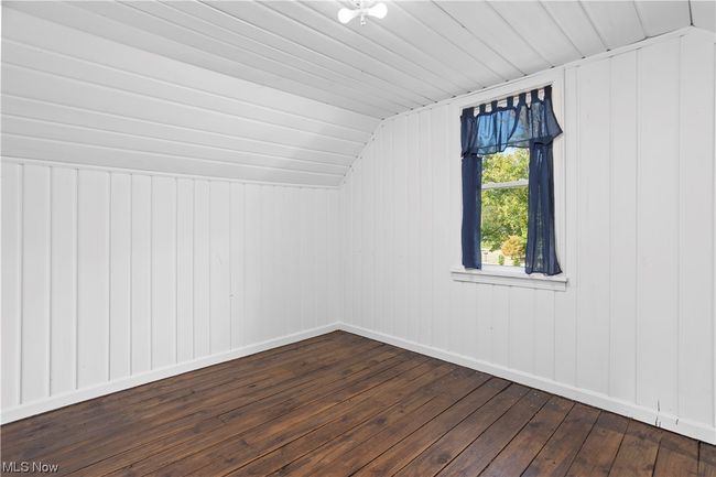 Additional living space featuring hardwood flooring and lofted ceiling | Image 23