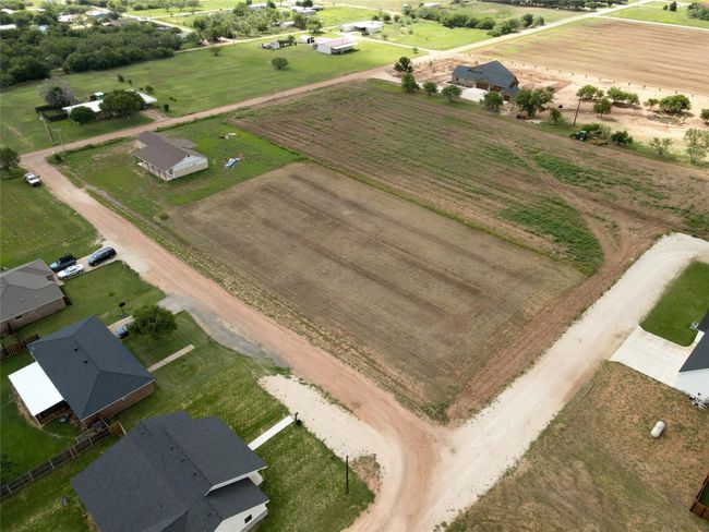 Aerial view of property and surrounding area featuring rural landscape and extensive farmland | Image 7
