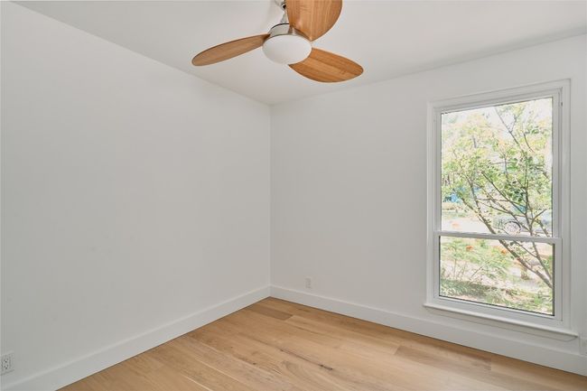 Bedroom with ceiling fan and closet | Image 16