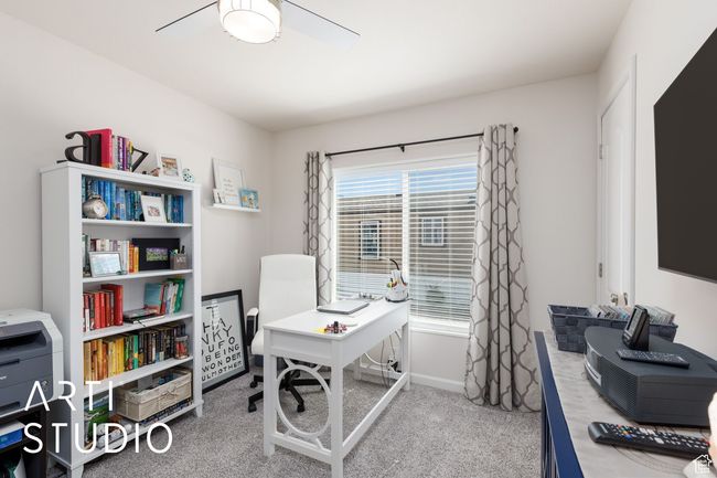 Carpeted office featuring ceiling fan and baseboards | Image 15