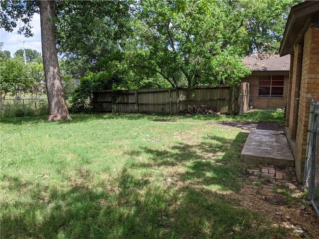 View of fenced backyard | Image 9