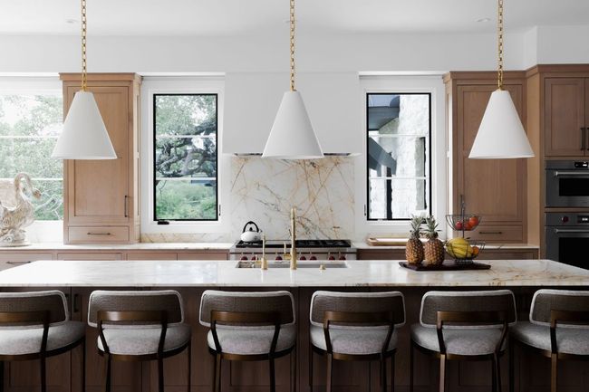 Kitchen with decorative backsplash, plenty of natural light, and decorative light fixtures | Image 14