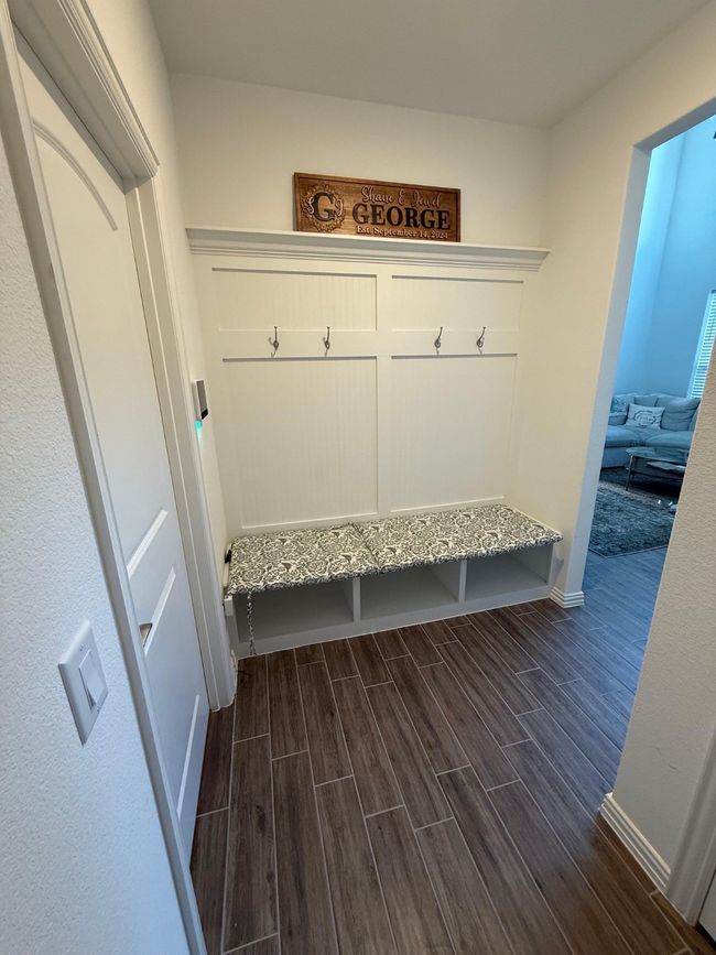 Mudroom featuring dark wood-style floors and baseboards | Image 21