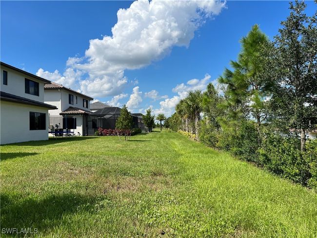View of yard featuring glass enclosure | Image 31