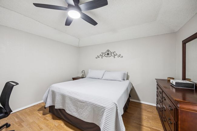 Primary bedroom with a ceiling fan | Image 12