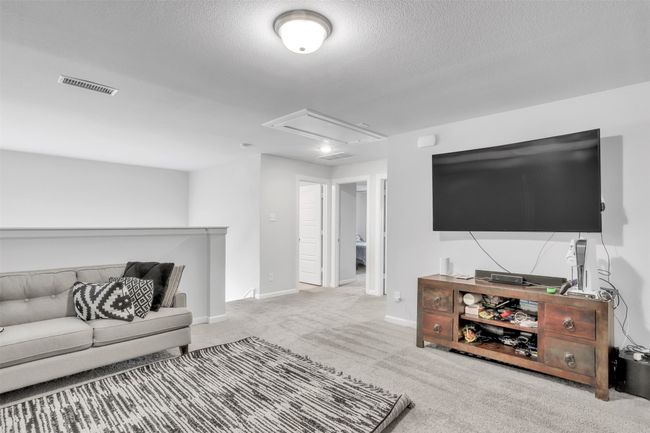 Upstairs 2nd living room featuring a textured ceiling | Image 23