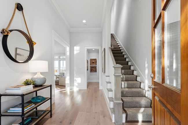 Entrance foyer with crown molding, stairs, recessed lighting, baseboards, and light wood finished floors | Image 4