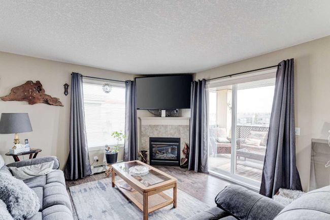 8429 - 304 Mackenzie Way Sw, Home with 2 bedrooms, 2 bathrooms and 2 parking in Airdrie AB | Image 1