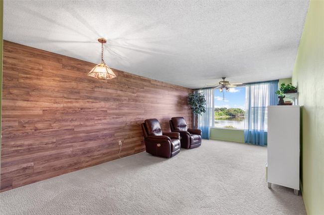 VIEW INTO DINING AND LIVING ROOM AREA. NOTE THE LAKE VIEW! | Image 10