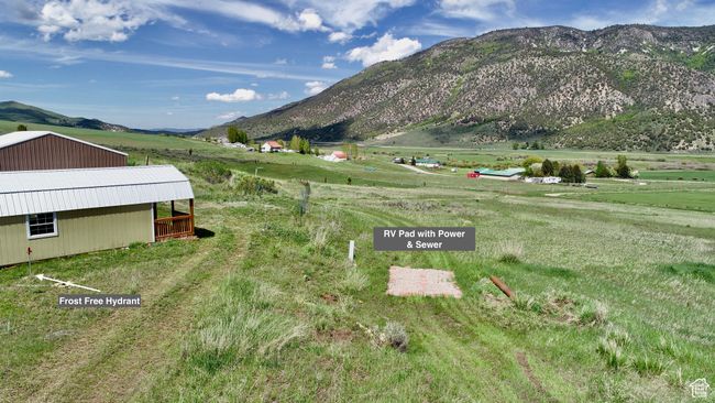 View of mountain backdrop featuring rural landscape | Image 16
