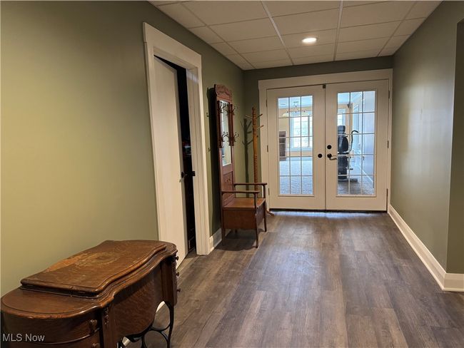 Guest room entryway featuring french doors & a wood-style flooring, baseboard | Image 46