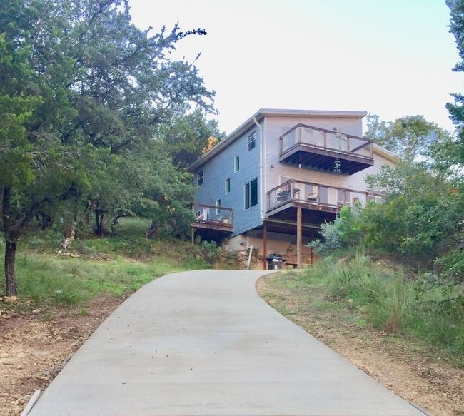 Concrete driveway up to the home. | Image 6