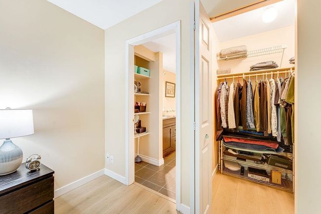 Spacious closet with wood finished floors | Image 5
