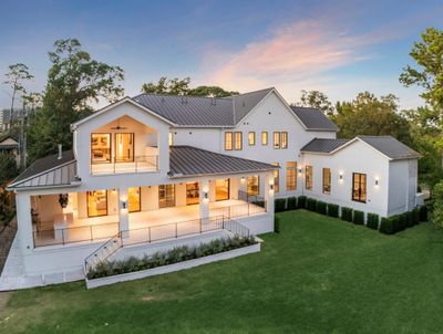 This stunning aerial view captures a luxury new construction home in prestigious River Oaks, situated on an expansive 20, 190-square-foot lot, as per Survey. The vast grounds offer endless possibilities, with ample space for a pool, sports court, or immaculate gardens. A truly exceptional property, combining grand design with outdoor potential in one of Houston's most coveted neighborhoods. | Image 2