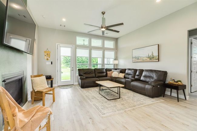 Abundant natural light poursthrough windows, creating a brightand inviting atmosphere. | Image 13