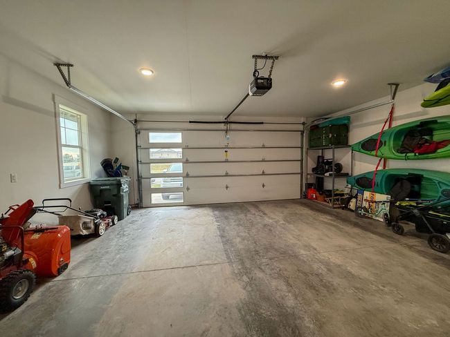 2 car Garage featuring garage door and heat | Image 36