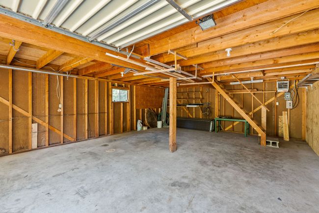 Interior of garage with a heating unit | Image 74