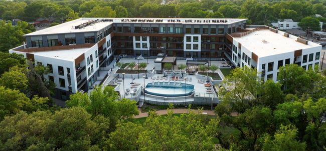 View of subject property featuring a pool and a forest | Image 30