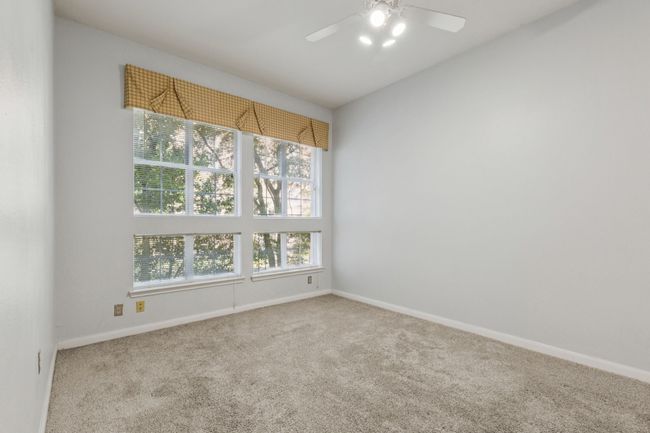 Unfurnished room featuring carpet and ceiling fan | Image 23