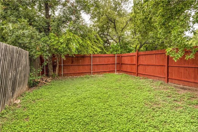 View of fenced backyard | Image 7