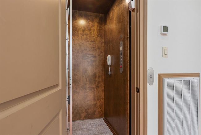 The conveniences of the residential elevator, located across from the dining room and off the game room. | Image 16