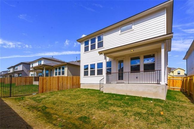Back of house with a fenced backyard | Image 27