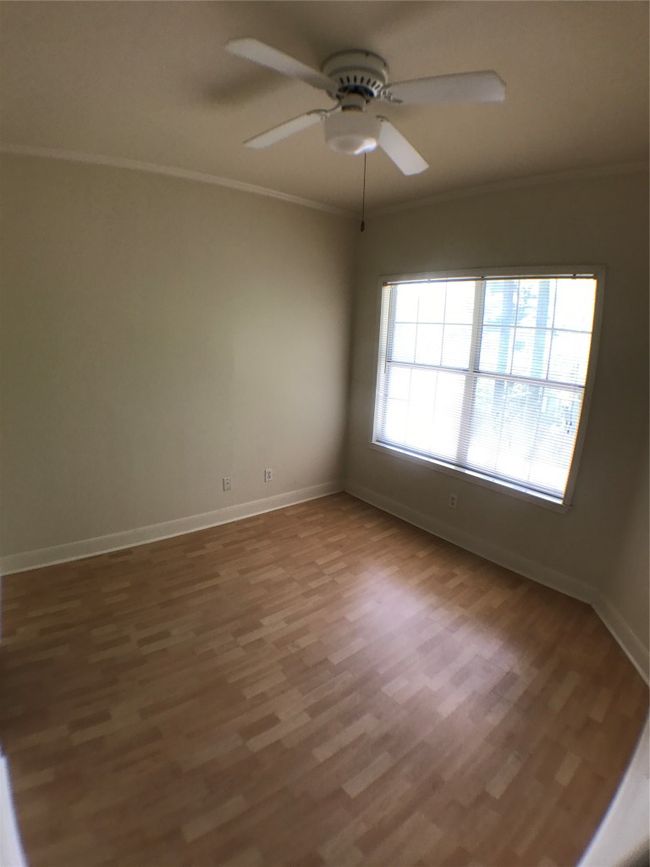 Spare room featuring baseboards, a ceiling fan, wood finished floors, and ornamental​​‌​​​​‌​​‌‌​‌‌​​​‌‌​​‌‌​‌​​​​​‌ molding | Image 9