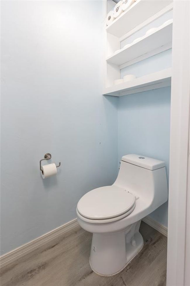 Bathroom with toilet and hardwood / wood-style floors | Image 33