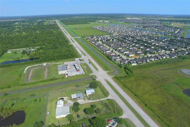 Ariel shot shows Hwy 288 in the back ground, New Hope Church in upper right corner, Rodeo Palms subdivision to the right | Image 9