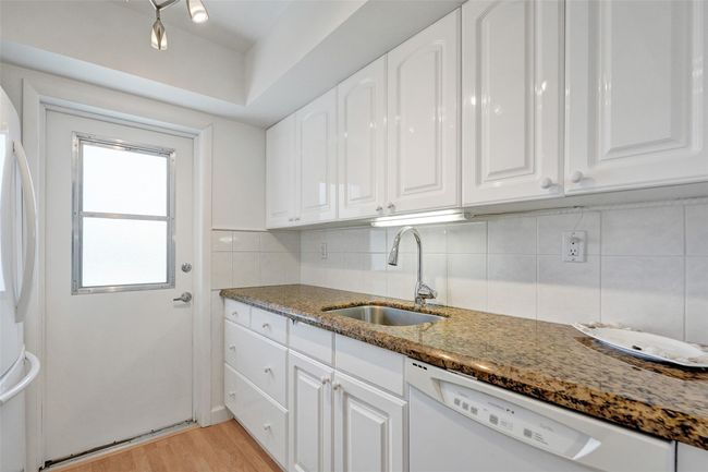 Beautiful granite countertops and plenty of kitchen cabinets | Image 17