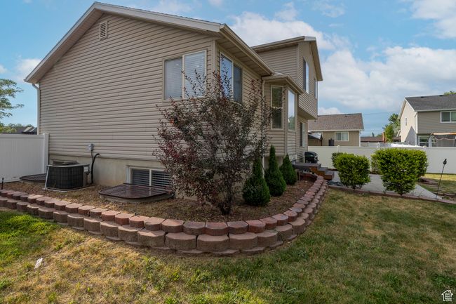View of home's exterior featuring a central AC unit | Image 29