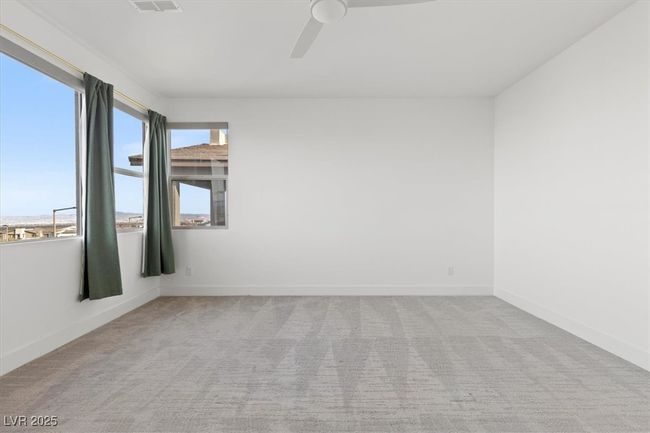 Empty room featuring carpet, ceiling fan, and baseboards | Image 33