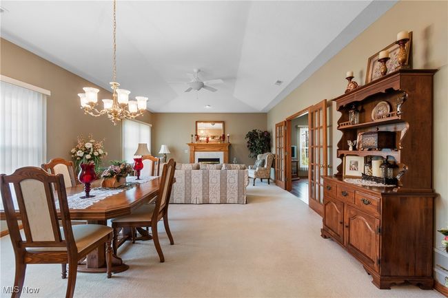 Dining area is at the end of the great room near the kitchen entrance. | Image 5