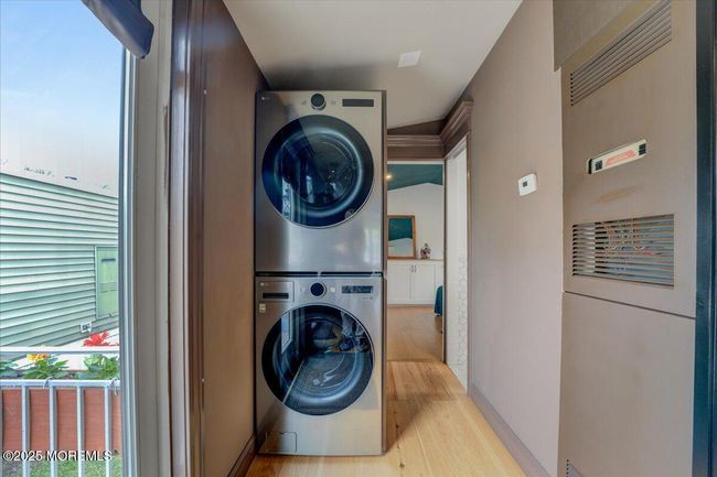 Laundry with cabinet behind for storage | Image 16