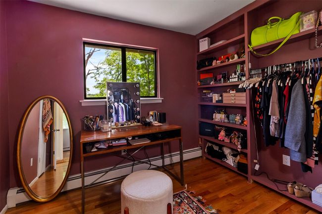 Bedroom featuring wood flooring | Image 11