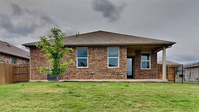 Rear view of property featuring brick siding | Image 8