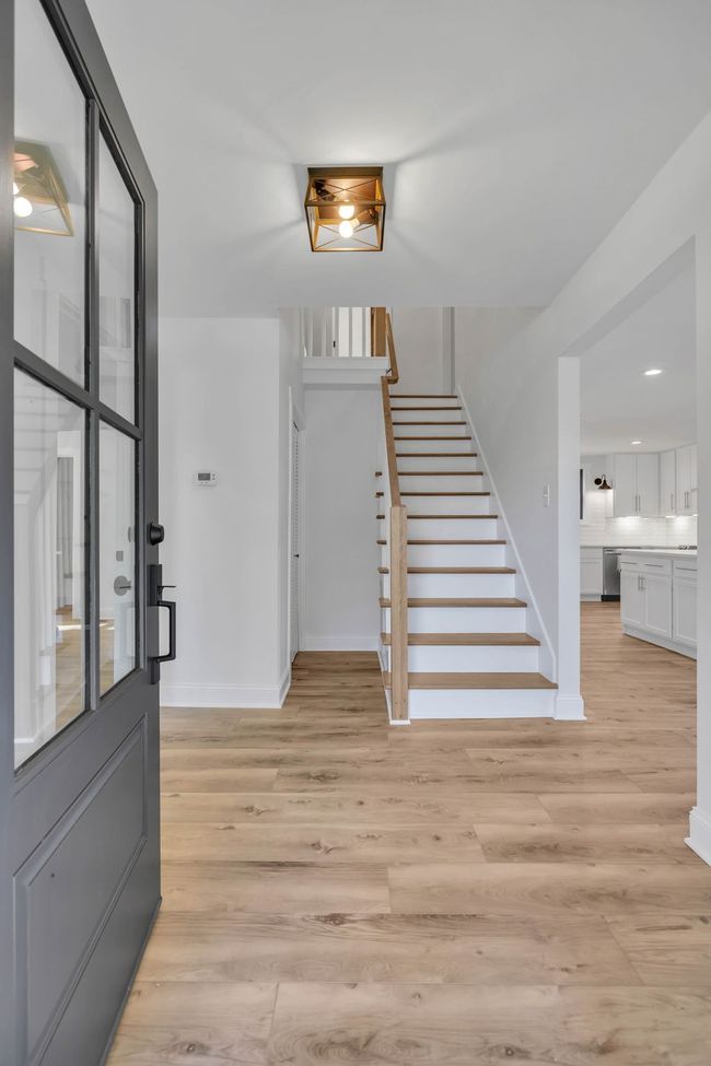 Big open foyer when you walk in the front door. These LVP waterproof floors are gorgeous and they are throughout the entire home. | Image 5