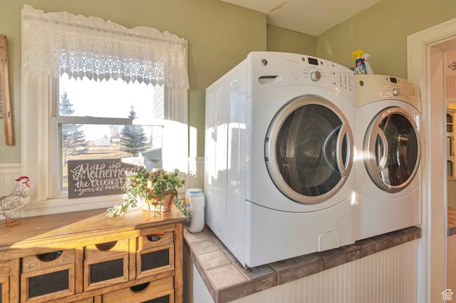 Laundry room with separate washer and dryer | Image 38
