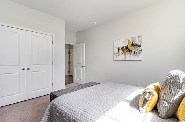 Carpeted bedroom featuring a closet | Image 15