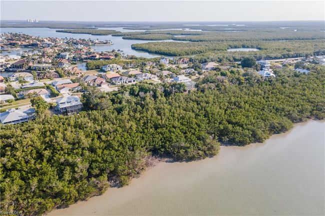 Birds eye view of property with a residential view, a view of trees, and a water view | Image 12