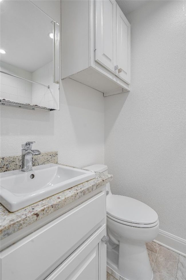 Bathroom featuring vanity, recessed lighting, baseboards, and toilet | Image 13