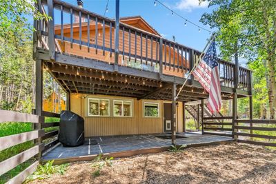 Rear view of property with a deck | Image 1