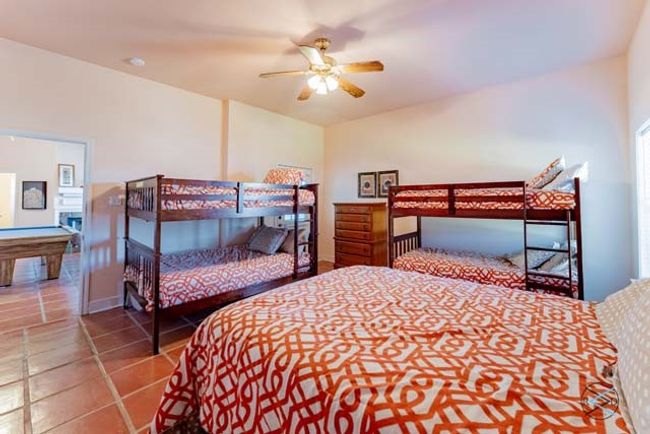 Downstairs guest bunk room has a private entrance to the downstairs patio. | Image 27