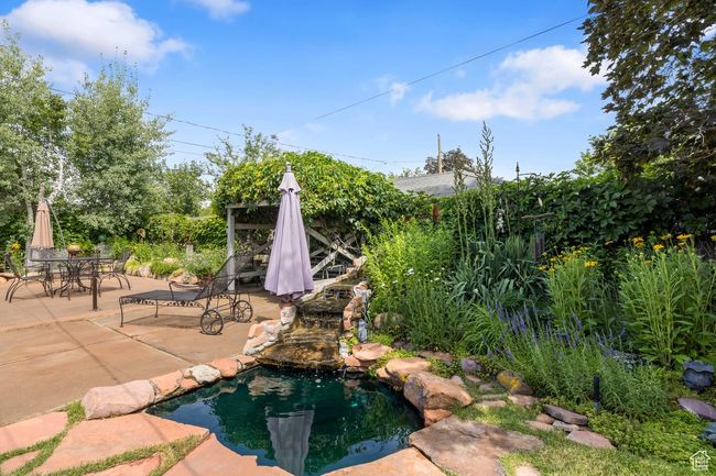 Outdoor pool with a patio and outdoor dining space | Image 24