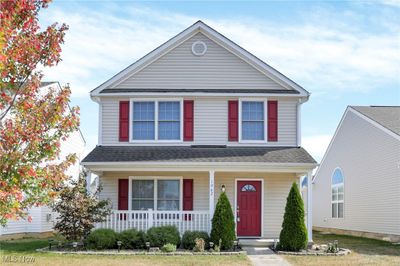 View of property with a porch | Image 1